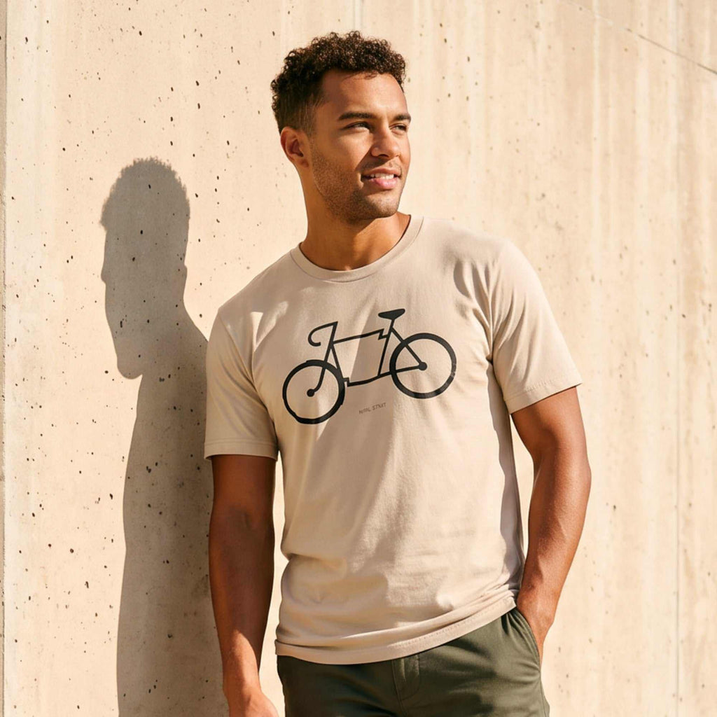 Man wearing a Bike Arkansas Tee featuring a bicycle graphic, celebrating cycling culture in Arkansas shirt.