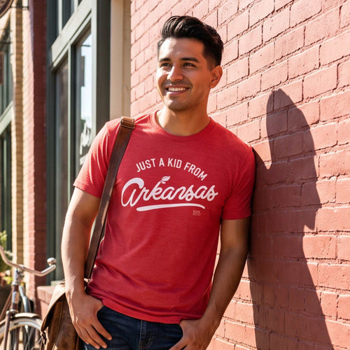 Just a Kid from Arkansas red cotton T-shirt with white script graphic and crew neckline