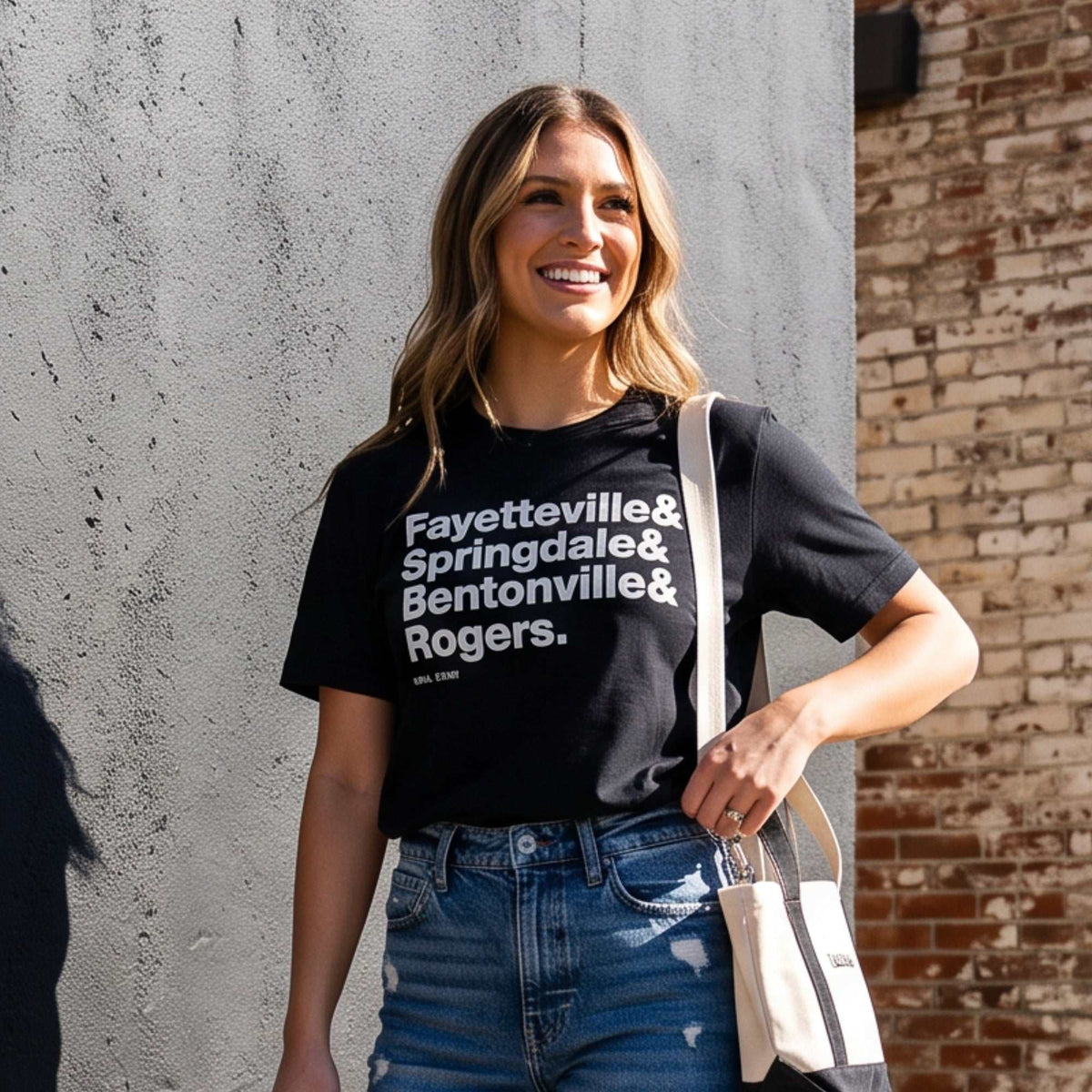 NWA Cities Tee in black cotton with bold white Fayetteville, Springdale, Bentonville and Rogers city print